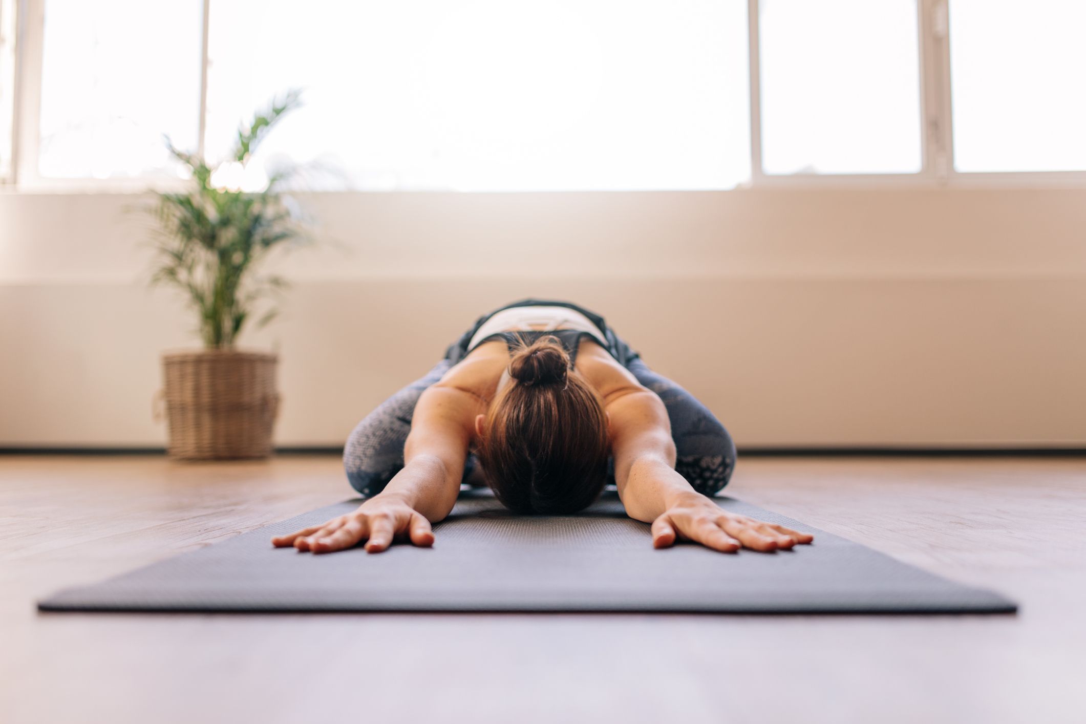 woman in child's pose in brighton yoga studio